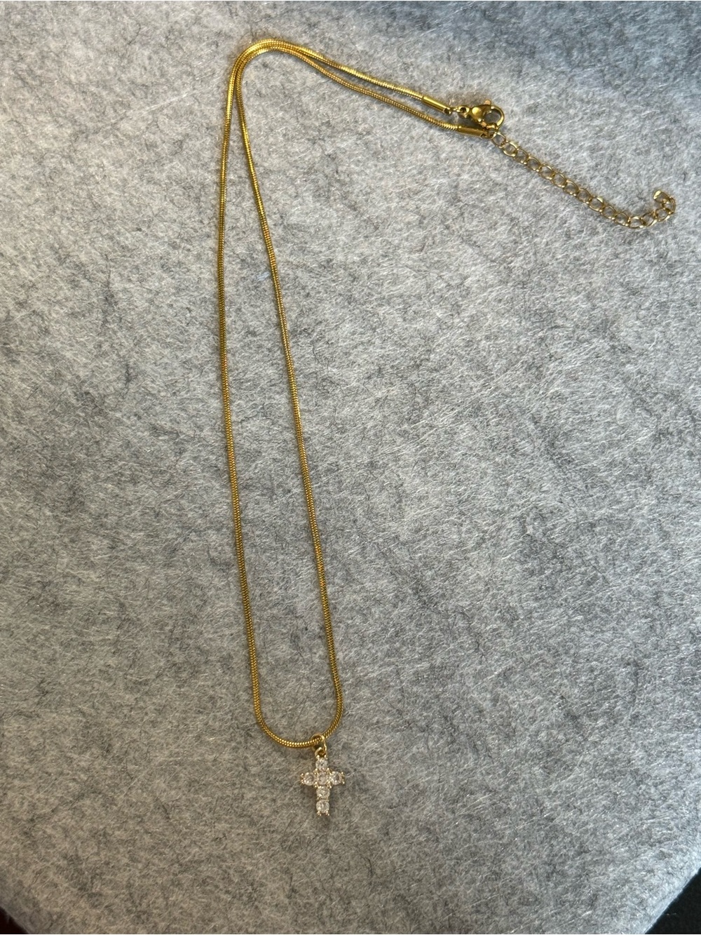 Gold-tone snake chain necklace with beautiful cross pendant
